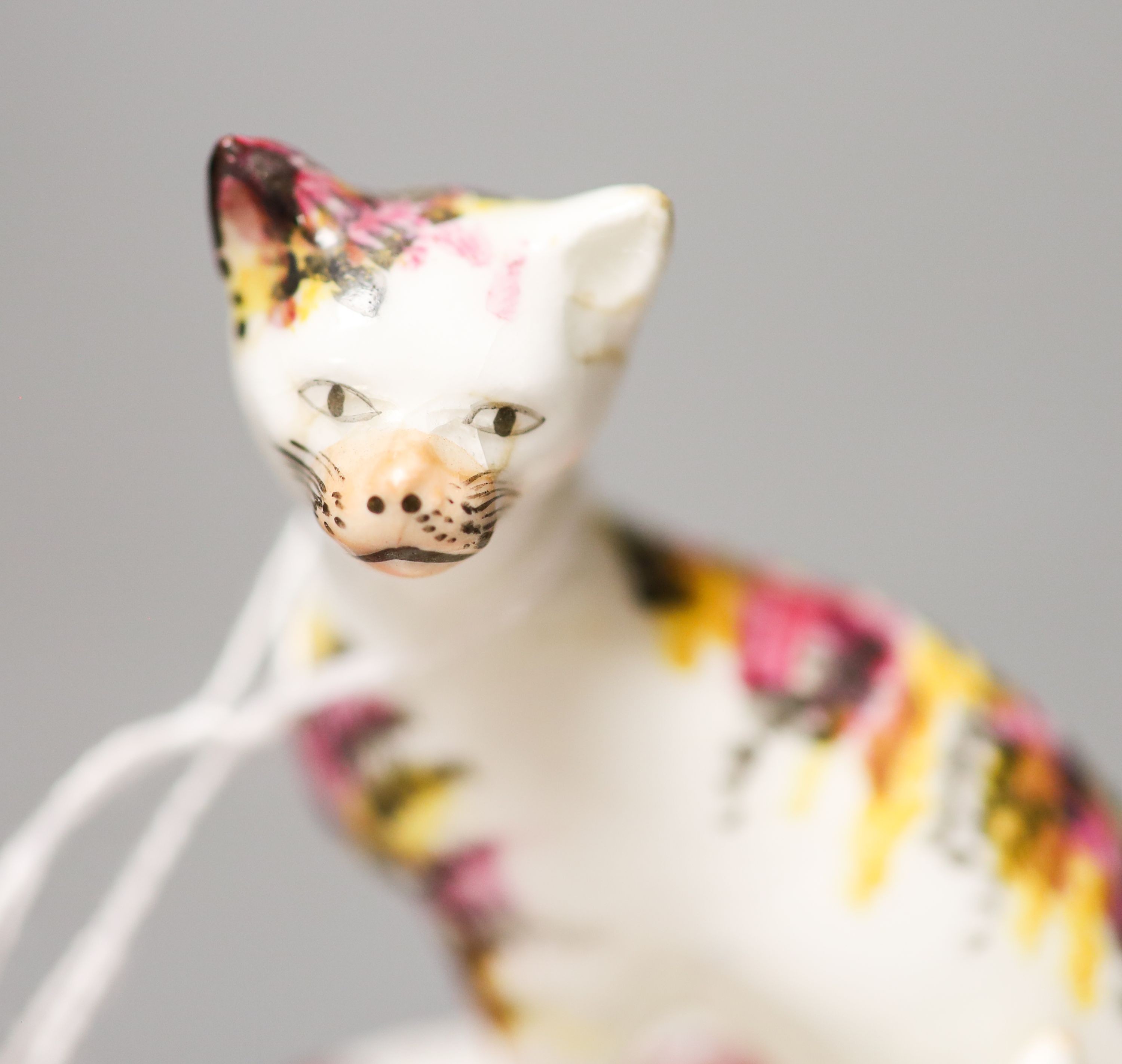 A Staffordshire porcelain group of a cat and kittens in a basket, c.1835-50 10cm